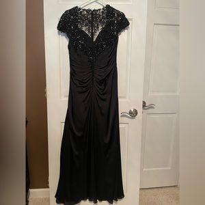 Full length black formal dress.
